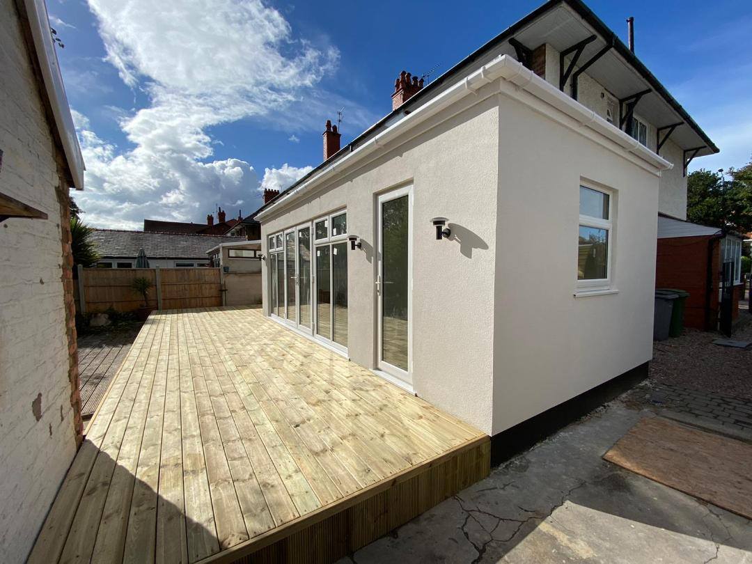 Kitchen and dining area in a conservatory with an insulated roof replacement
